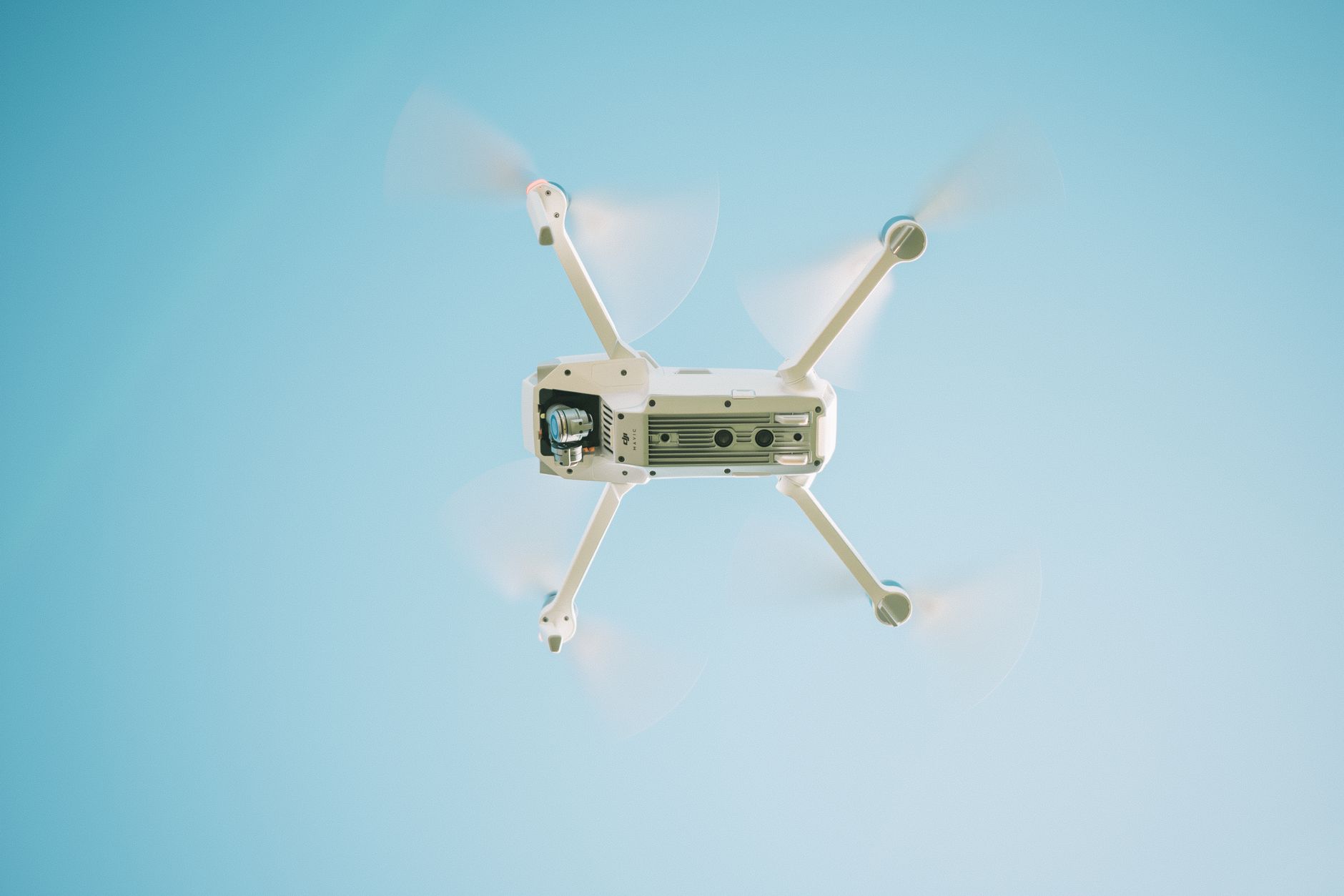 Multirotor drone inspecting high-voltage transmission towers and lines